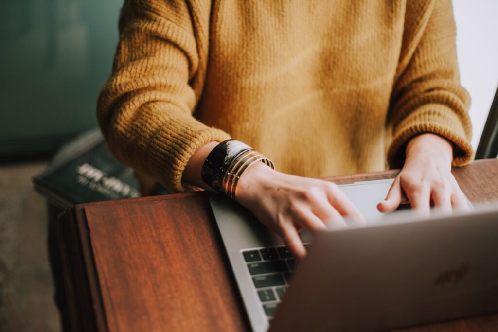 Woman typing at computer